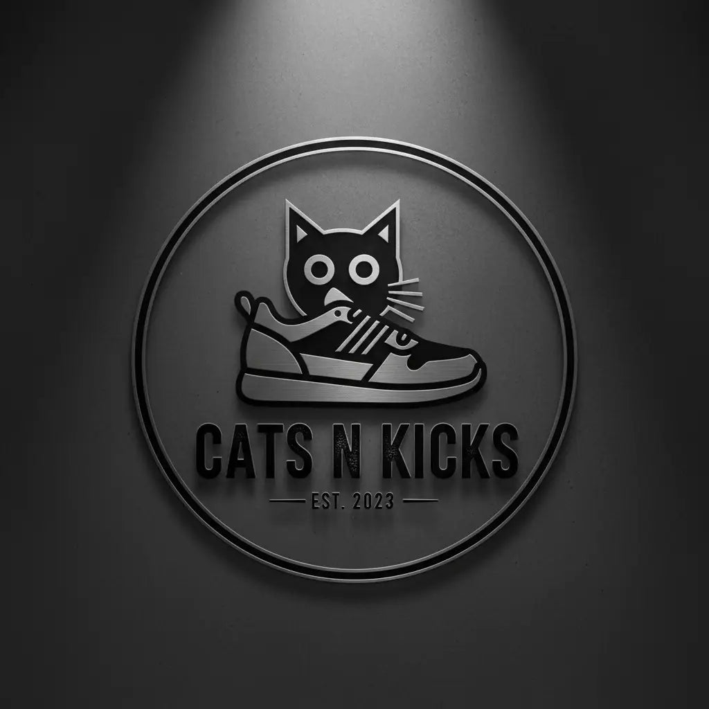 Circular metallic logo featuring a black cat holding a sneaker with text cats n kicks est in all products collection