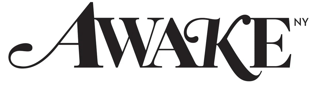 Black awake ny logo in elegant stylized serif font from the Awake NY collection on a black background