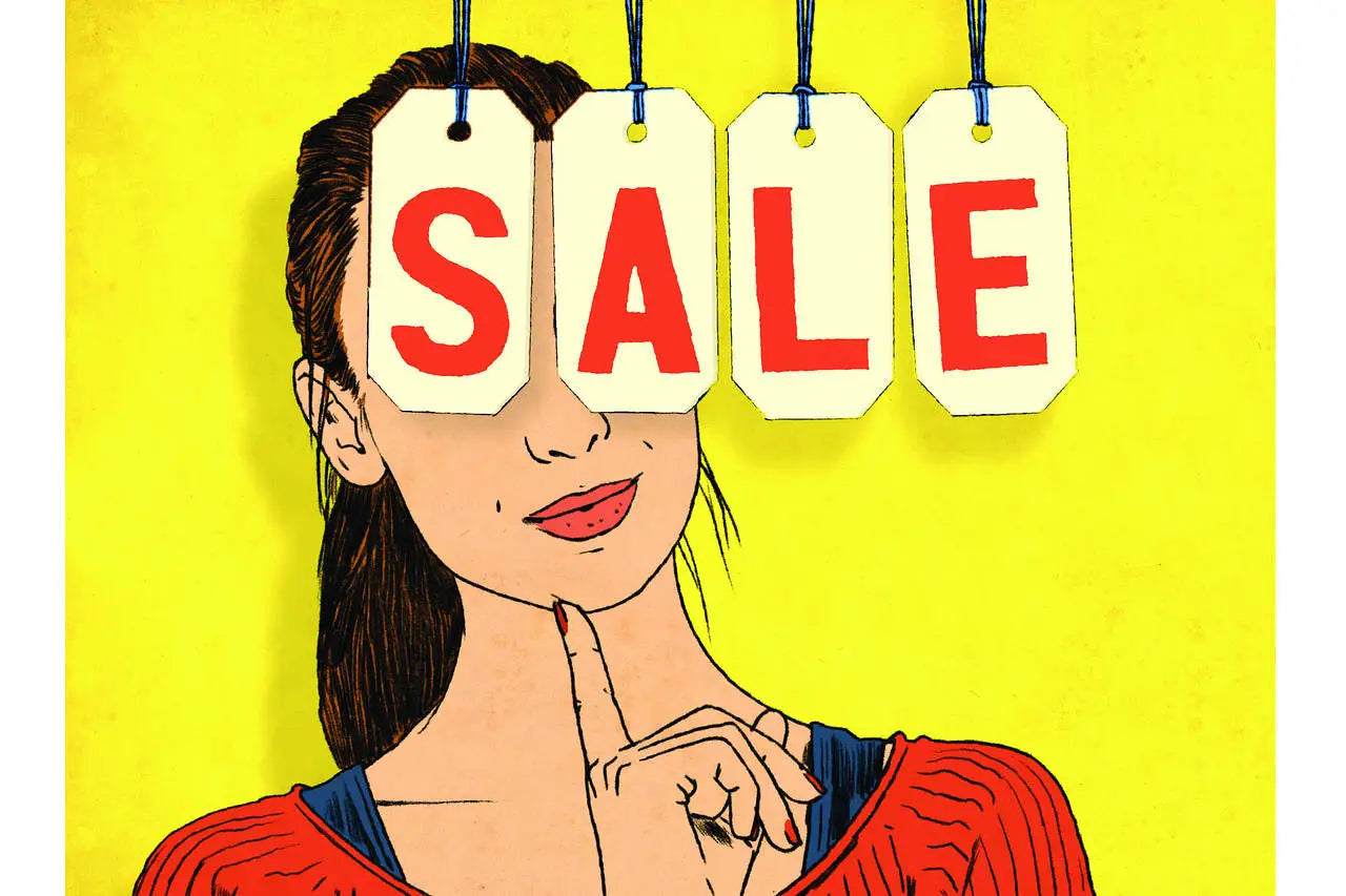 A woman with brown hair wearing a red and blue top partially obscured by four white sale price tags in bargains collection