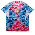 Adidas x Bape football jersey shock in vibrant blue and pink camouflage with white sleeve stripes and gold Bape logo