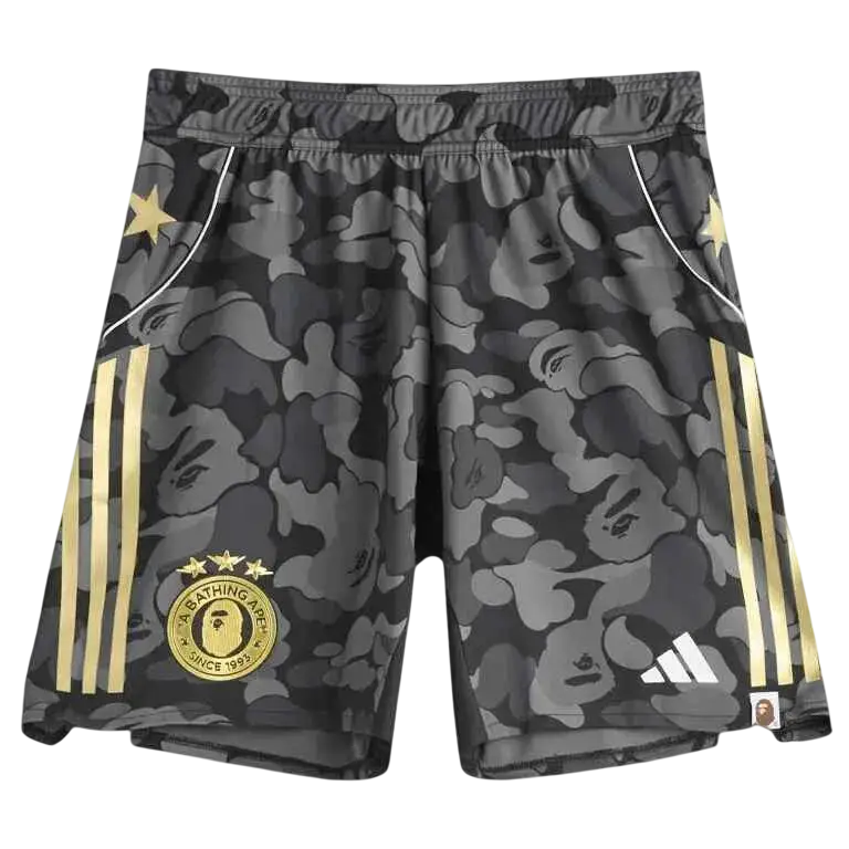 Adidas x Bape soccer shorts in black and gray camouflage with gold stripes, Bape logo patch, and Adidas branding