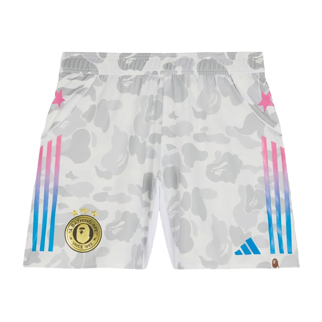 Adidas x Bape soccer shorts white with white and gray camouflage, pink to blue gradient stripes, gold a bathing ape patch, and Adidas logo