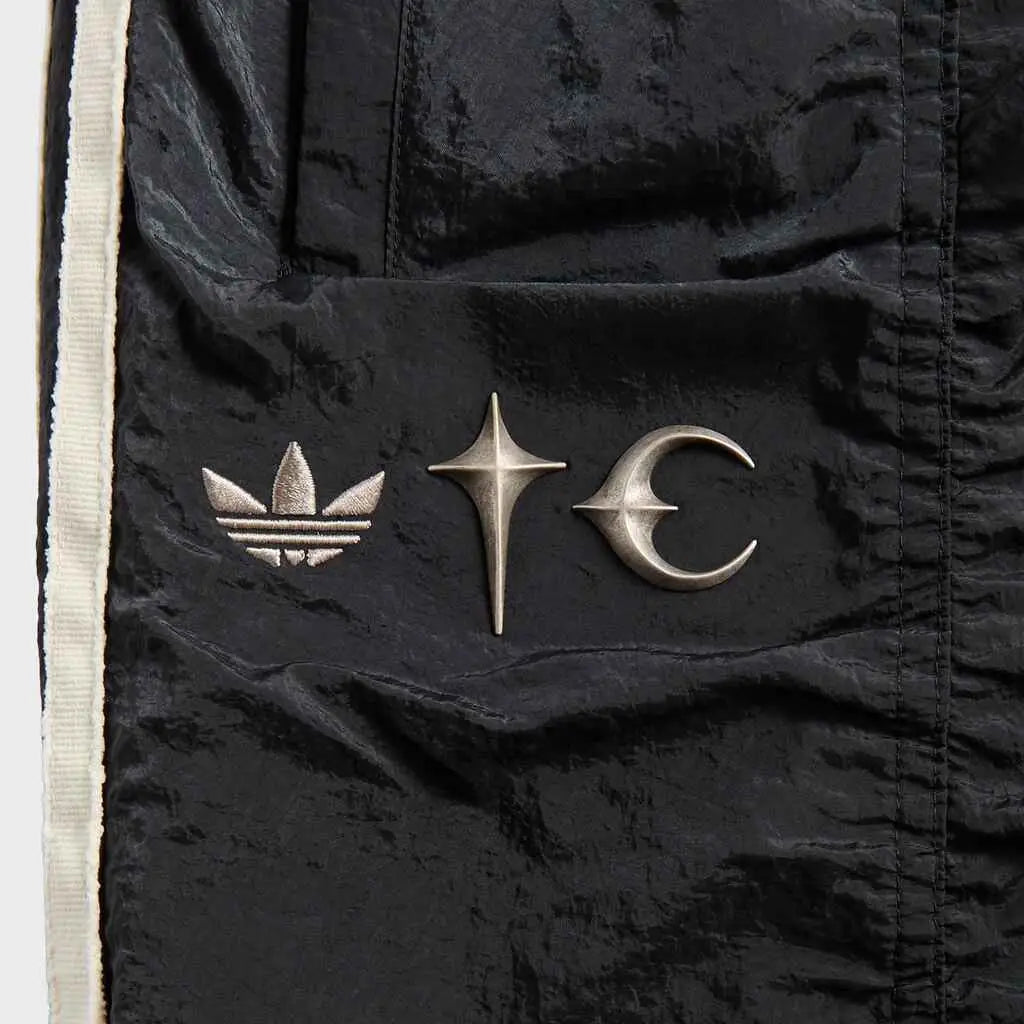 Black adidas x thug club teamgeist sweat pants with silver embroidered trefoil starburst and crescent moon logos