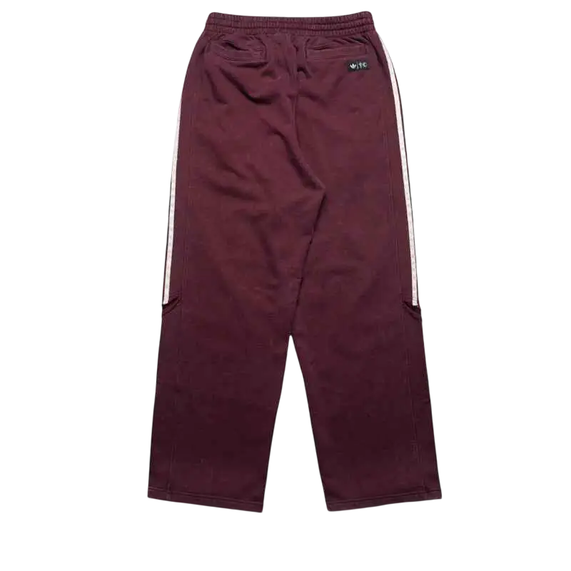 Adidas x Thug Club Teamgeist maroon sweatpants with white side stripes and drawstring waistband for casual wear