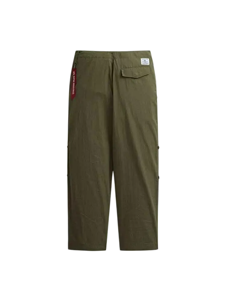 Back view of olive green alpha industries lightweight parachute cargo pants with red tag and white label on waistband