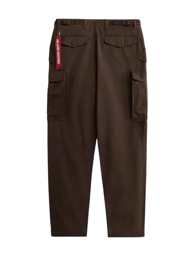 Alpha Industries M-65 chocolate cargo brown pants with multiple pockets and a red tag on the waistband