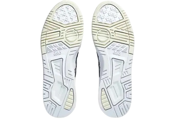 White rubber soles of asics ex89 white midnight shoes with textured geometric tread pattern and subtle branding details
