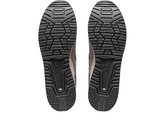 Black rubber soles with geometric tread pattern and embossed branding on asics gel-lyte iii og white sienna sneakers