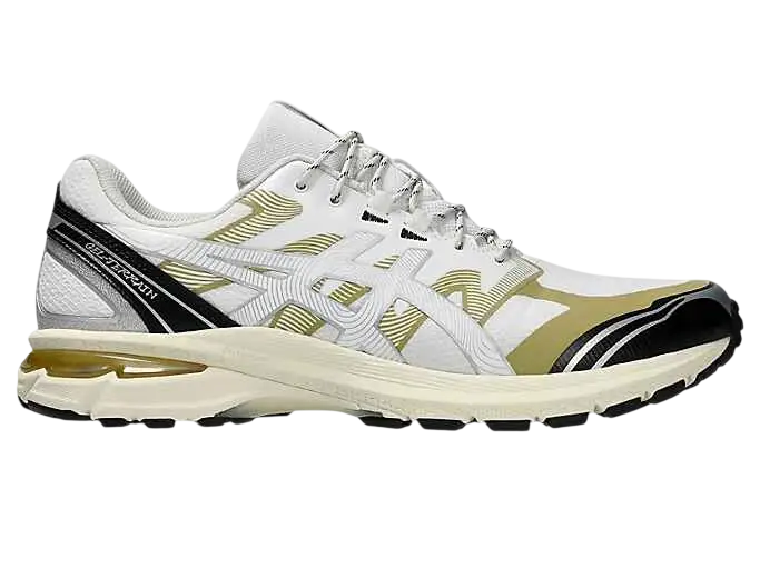Asics gel-terrain white and gold running shoe with black accents and translucent yellow air unit in the heel