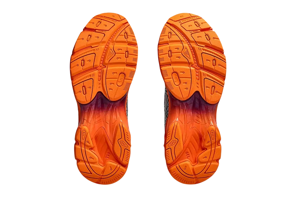 Vibrant orange rubber soles with textured tread on asics x kiko kostadinov ub7-s gt-2160 running shoes