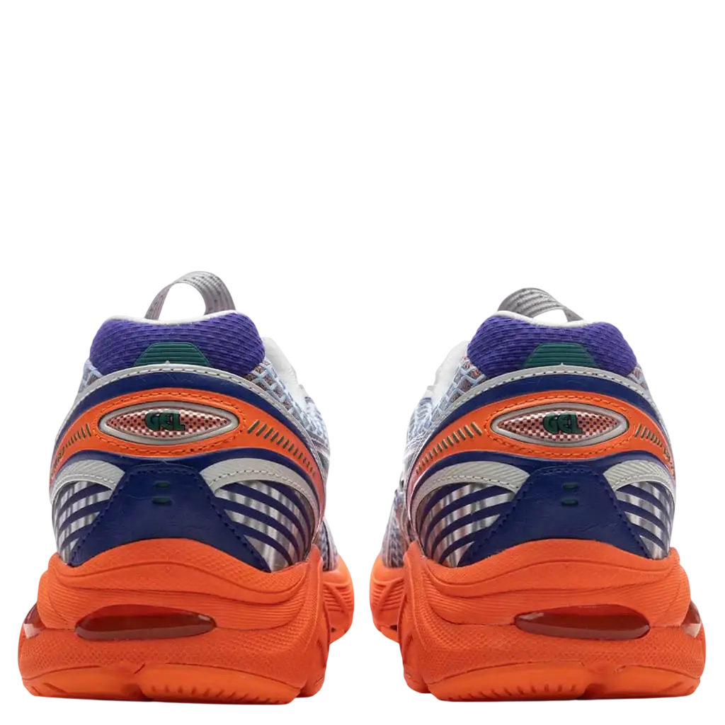 Vibrant orange and navy blue Asics Gel-Kayano 14 running shoes with purple accents and mesh upper in Lava Orange colorway