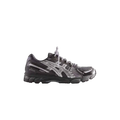 Asics x Kith Gel-Kayano 12.1 black and silver running shoe with mesh upper and textured rubber sole