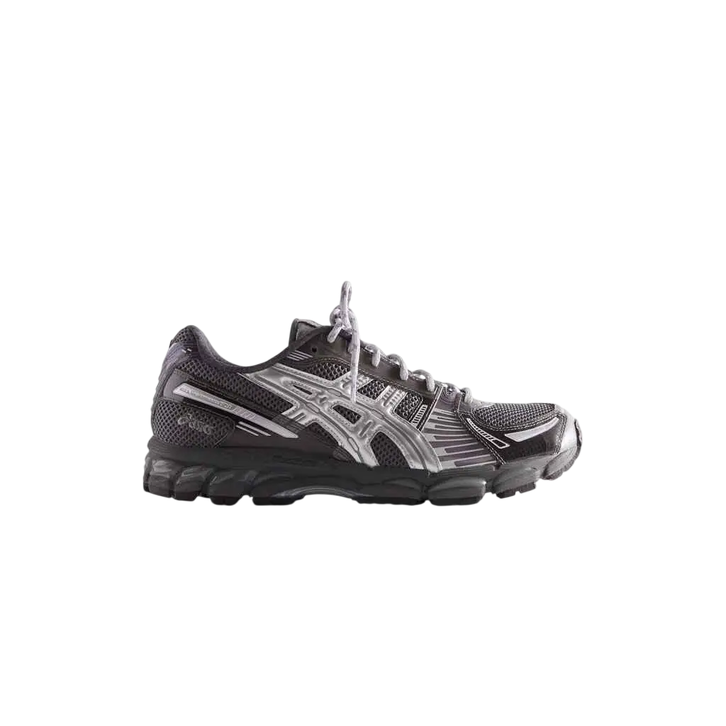 Asics x Kith Gel-Kayano 12.1 black and silver running shoe with mesh upper and textured rubber sole