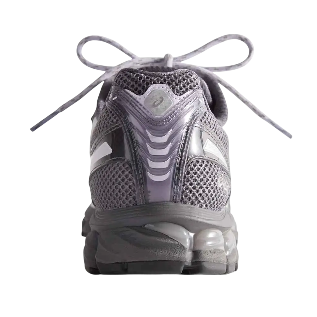 Asics x kith gel-kayano 12.1 running shoe with gray and white mesh upper, reflective stripes, and cushioned sole