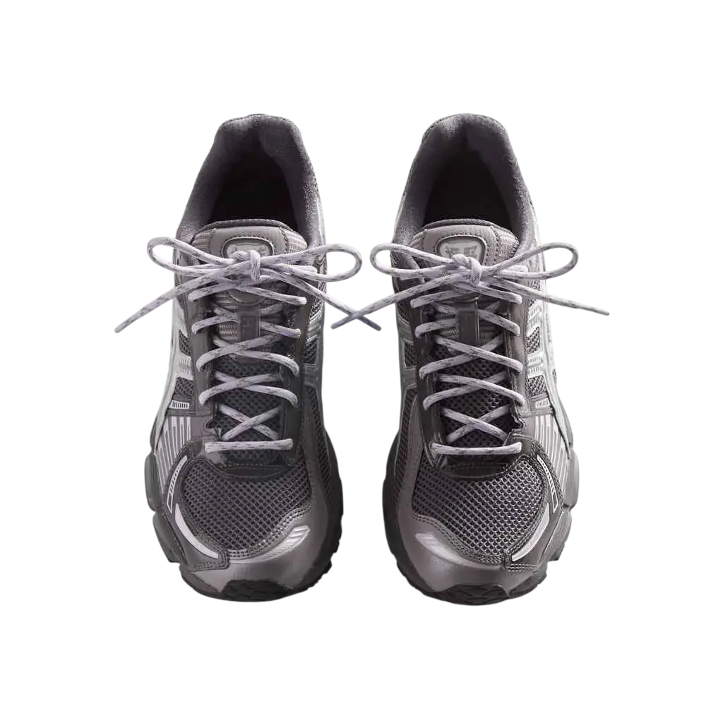 A pair of asics x kith gel-kayano 12.1 tornado pure silver running shoes with metallic silver mesh uppers and white accents