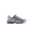 Silver and white asics gel-kayano 27 running shoe with reflective accents in asics x kith x marvel silver surfer design