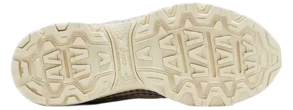 Cream-colored rubber sole with geometric tread and embossed asics branding on asics x story mfg gel-venture 6 shoes