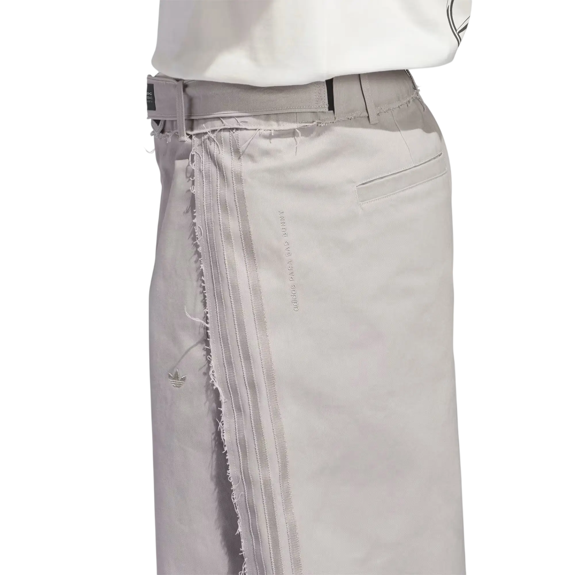 Light gray distressed denim Bad Bunny x Mercedes AMG race pants with three stripes and adidas logo near the hem