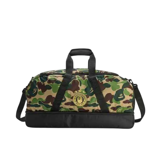 Bape x Adidas camo duffle bag with green brown beige camouflage pattern black handles and circular logo patch