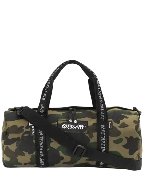 Bape x Outdoor Products green camouflage duffel bag with black straps and outdoor logo patch for outdoor use