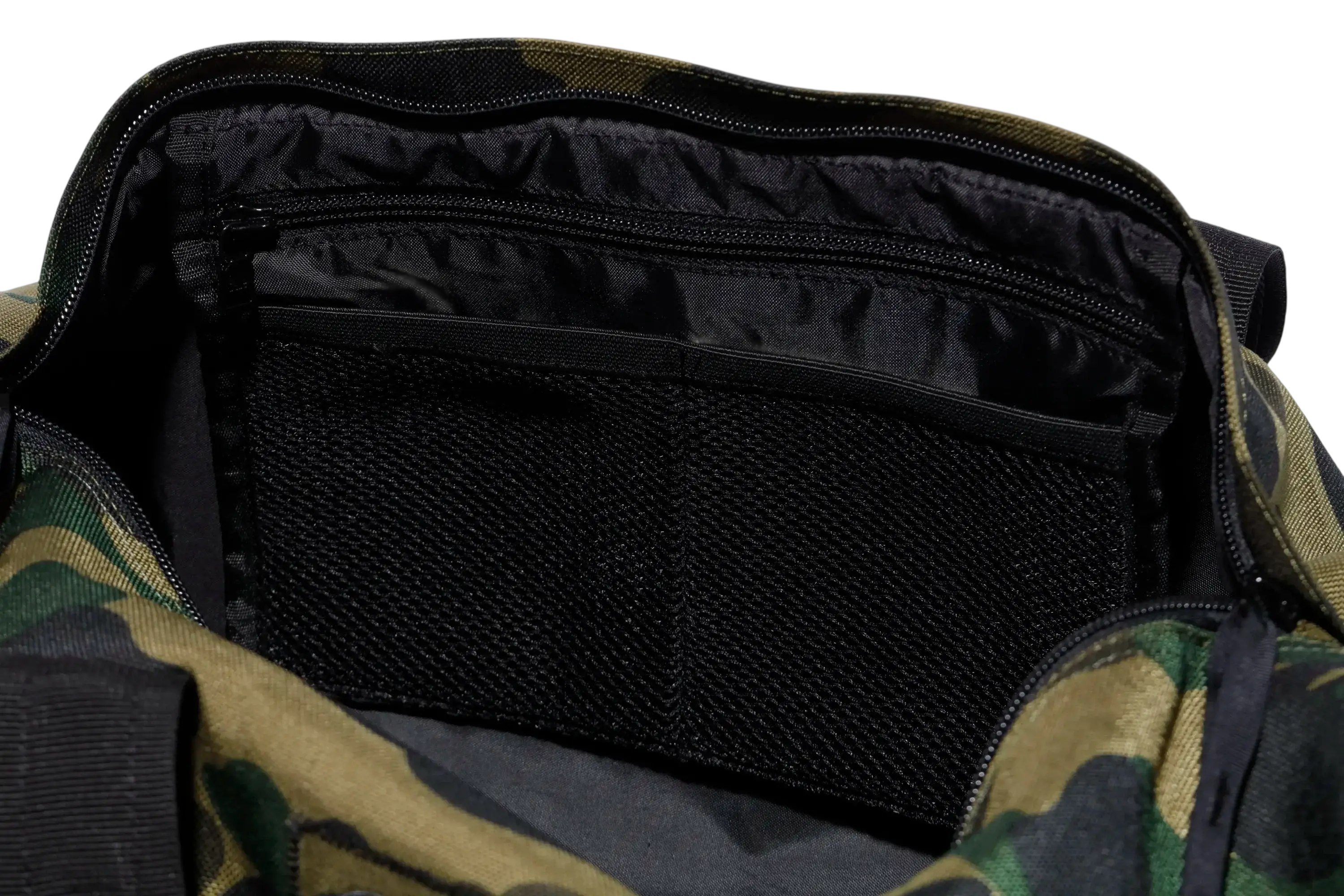 Bape x Outdoor Products green camo duffel bag with black interior lining and mesh pocket for organized storage