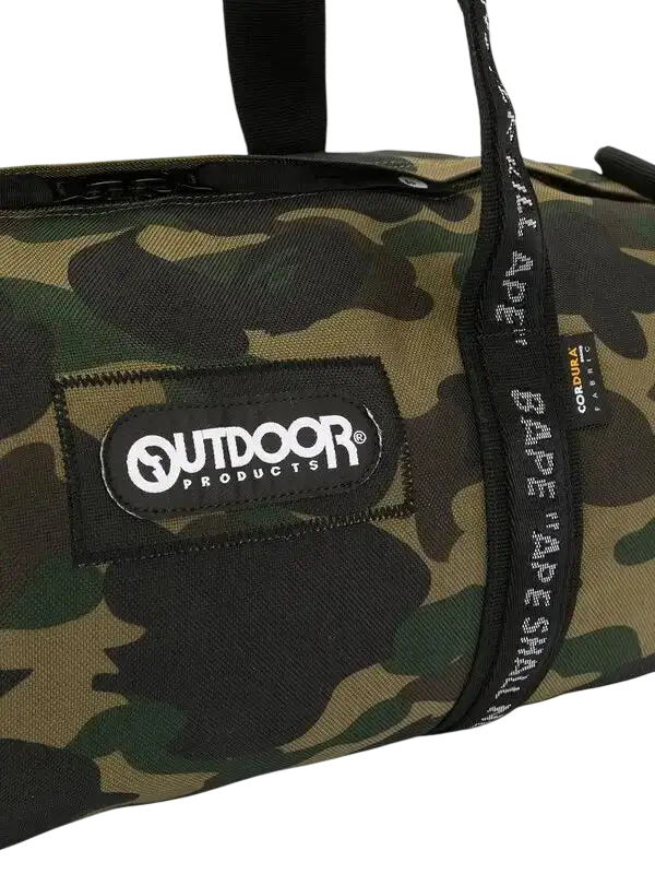 Bape x outdoor products green camouflage duffel bag with black fabric straps and branded patch