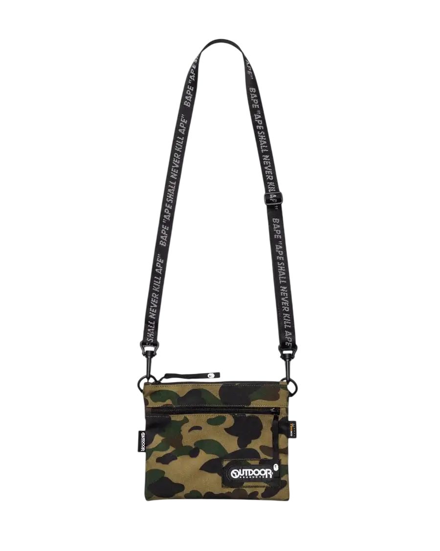 Bape x Outdoor Products camo mini shoulder bag green with camouflage pattern and black strap featuring repeating bape text