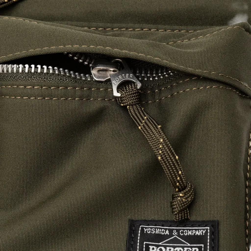 Comme des Garcons x Porter Yoshida khaki olive canvas shoulder bag with silver-toned zipper pull and braided cord