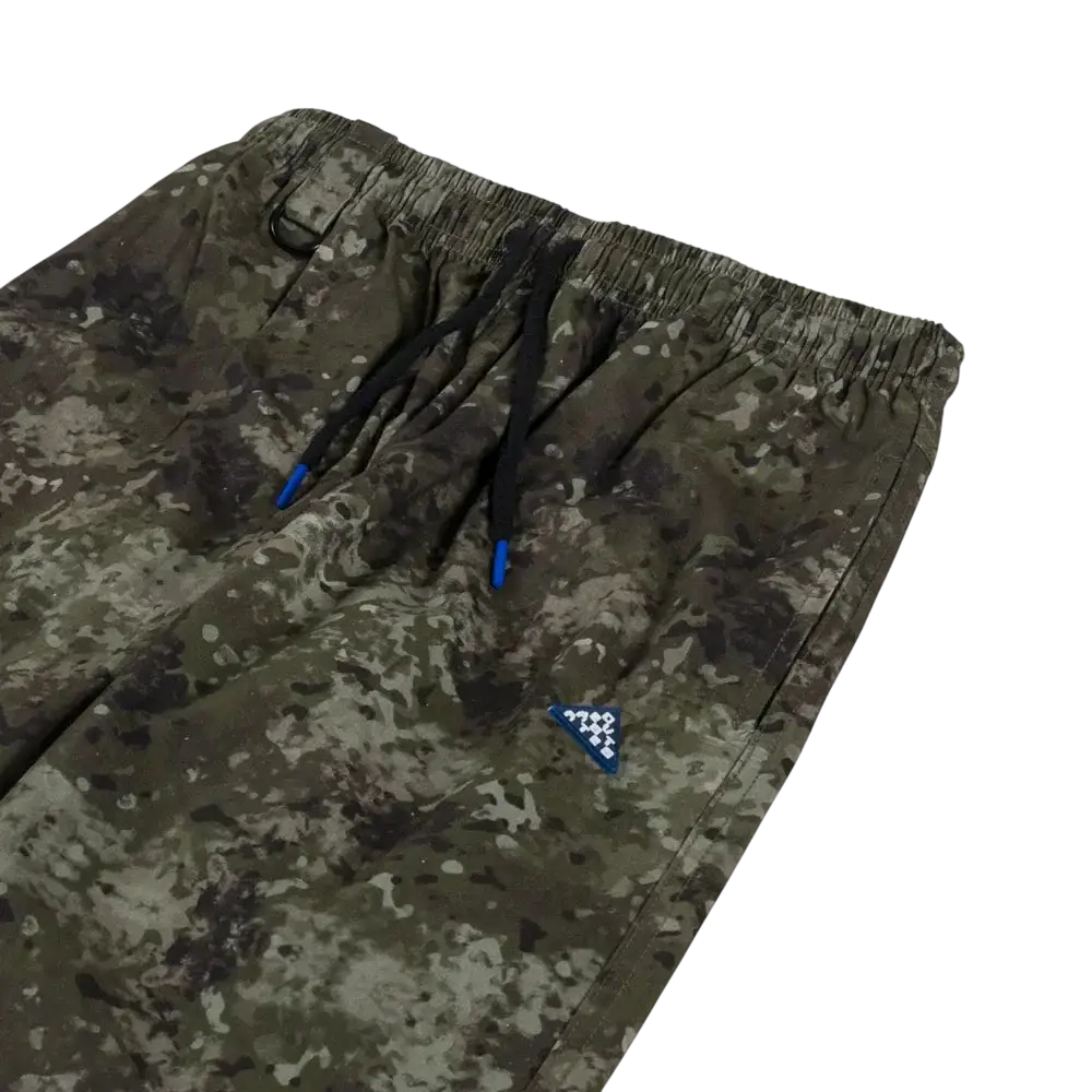 Deva States camo easy pants featuring camouflage pattern joggers with black drawstrings with blue tips and triangular patch