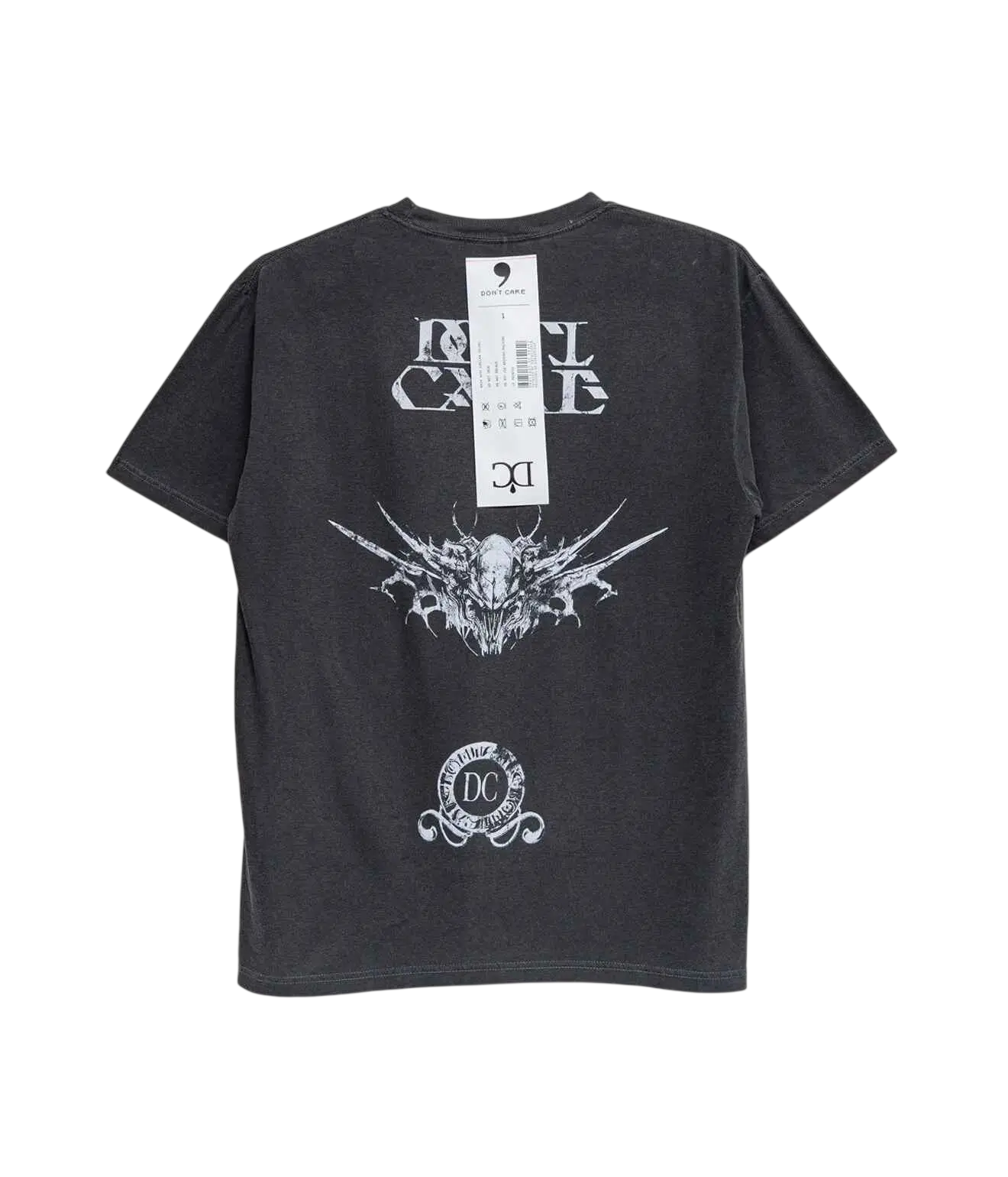 Dark gray short-sleeved cotton t-shirt with white ornate winged skull graphic and dont cry text called dont care tshirt black