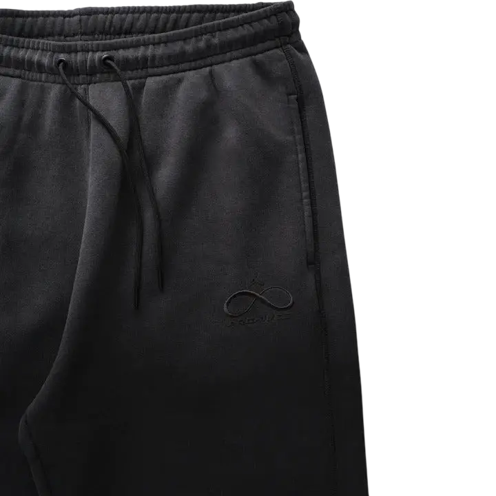Black jordan x infinite archives sweatpants with drawstring waist and subtle embroidered logo on the thigh