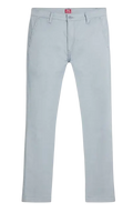 White denim pants with classic five-pocket design and red Levi’s brand tag at the waistband in chino standard taper style