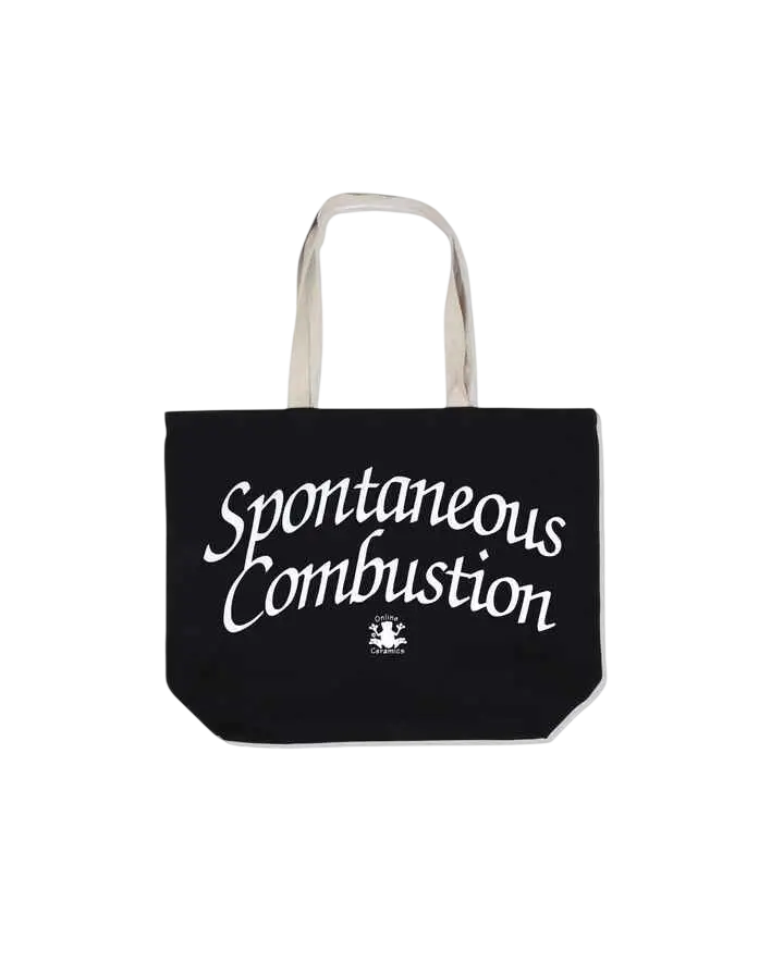 Black canvas tote bag with white handles featuring spontaneous combustion in stylized script by Online Ceramics