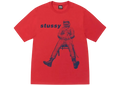 A vibrant red Stussy astronaut tee with a bold blue graphic of an astronaut seated on a chair