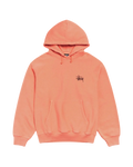 A soft peach-colored stussy basic hoodie pigment dyed sherbet with minimalist black logo and matching drawstrings