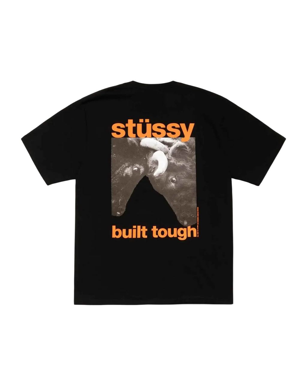 Black stussy built tough tee featuring bold orange logo and black and white dog graphic on black cotton fabric
