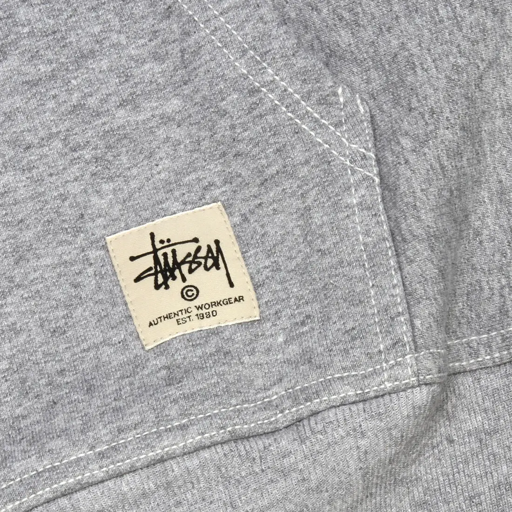 Gray heathered stussy contrast stitch label hoodie with black logo on cream patch in authentic workgear style