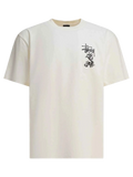 Cream-colored Stussy double dragon pigment dyed tee with black embroidered dragon logo on left chest in natural shade