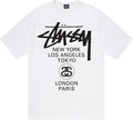 White stussy futura world tour tee featuring bold black logo graphic and city names including New York and Tokyo