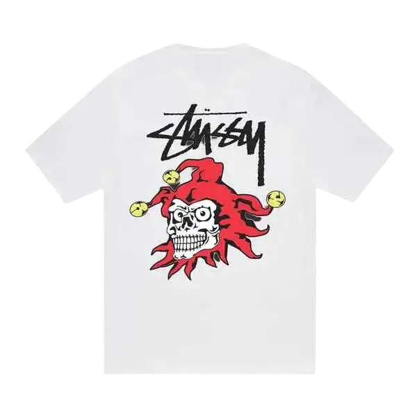 White stussy joker tee featuring a bold red and black skull graphic with a jester hat and yellow bells