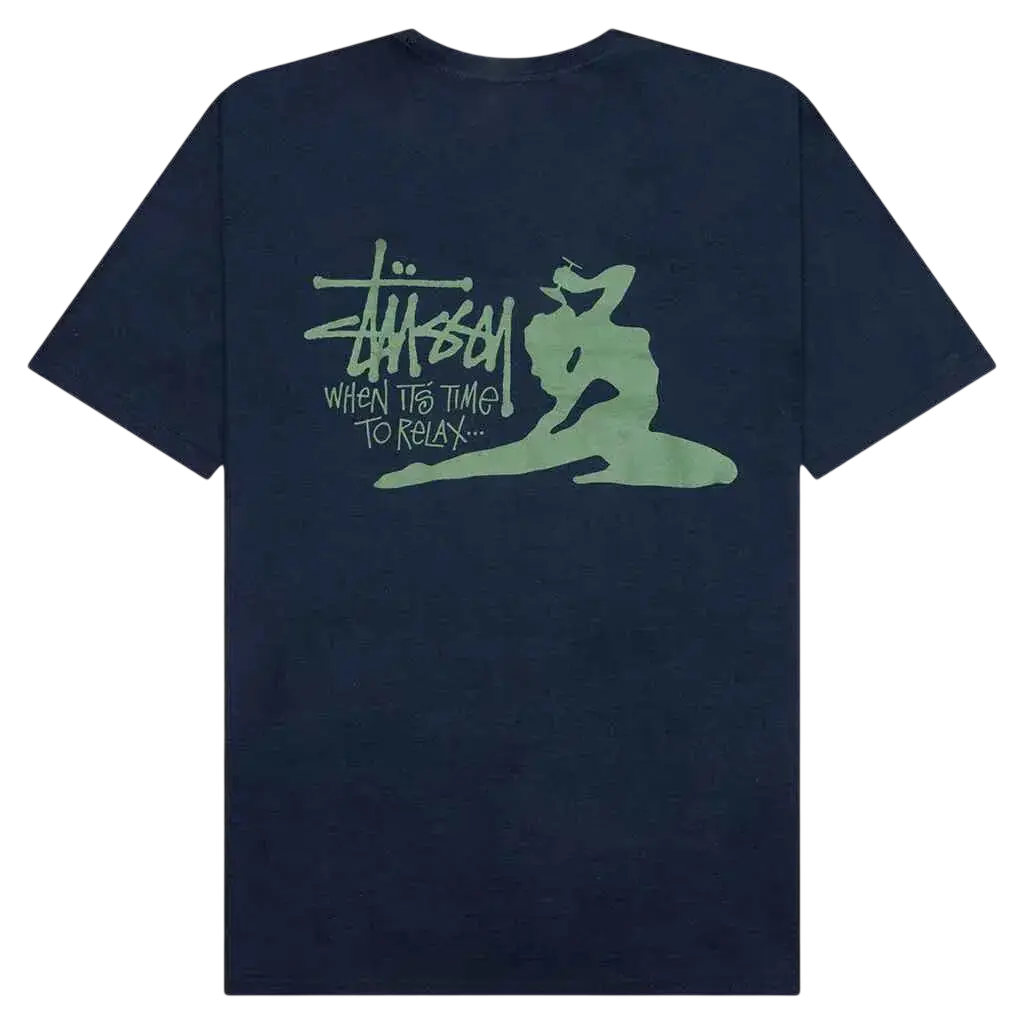 Dark blue stussy relax tee with glowing green graphic of brand logo and stylized figure on the front
