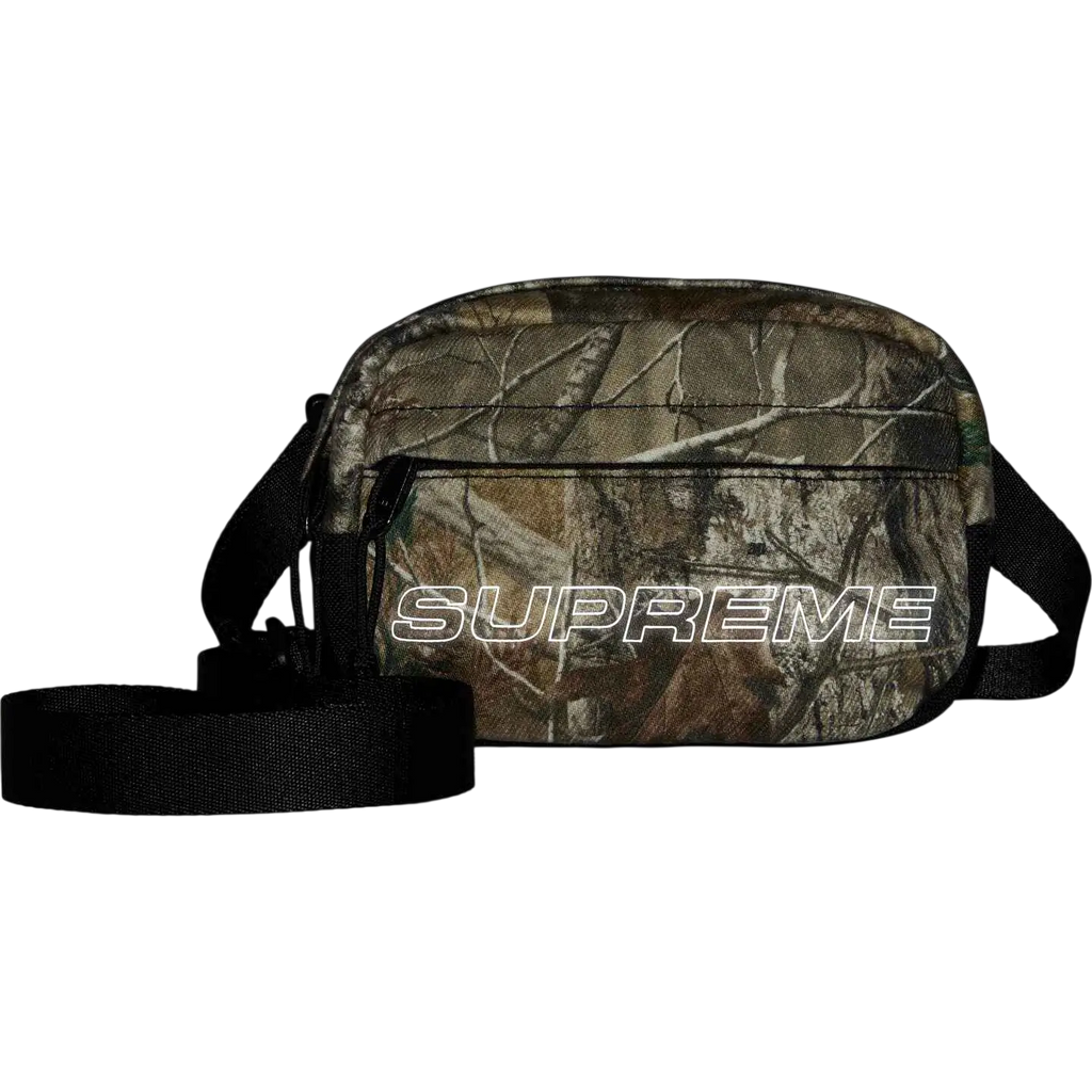 Supreme denim mini shoulder bag camo fw25 with camouflage pattern black strap and white outlined logo