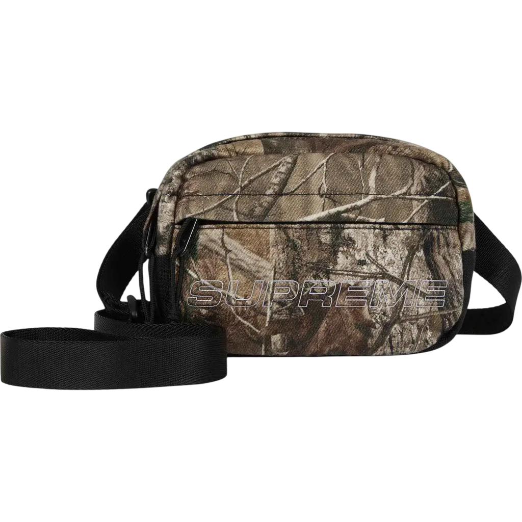 Supreme denim mini shoulder bag camo fw25 with camouflage pattern black strap and front zipper pocket