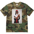 Camouflage-patterned supreme t-shirt with a printed portrait of rapper playboi carti in woodland camo colors