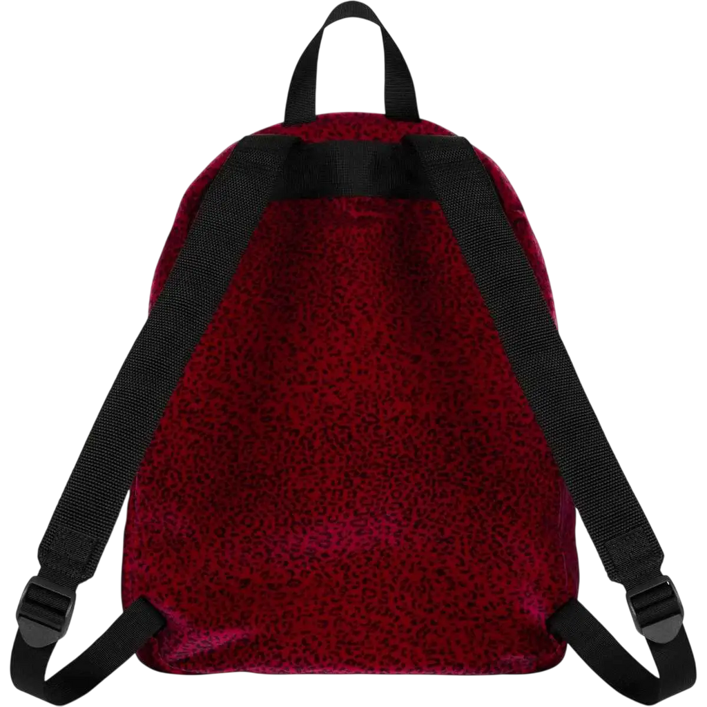Supreme velvet backpack in red with leopard print features black straps and buckles in red velvet material