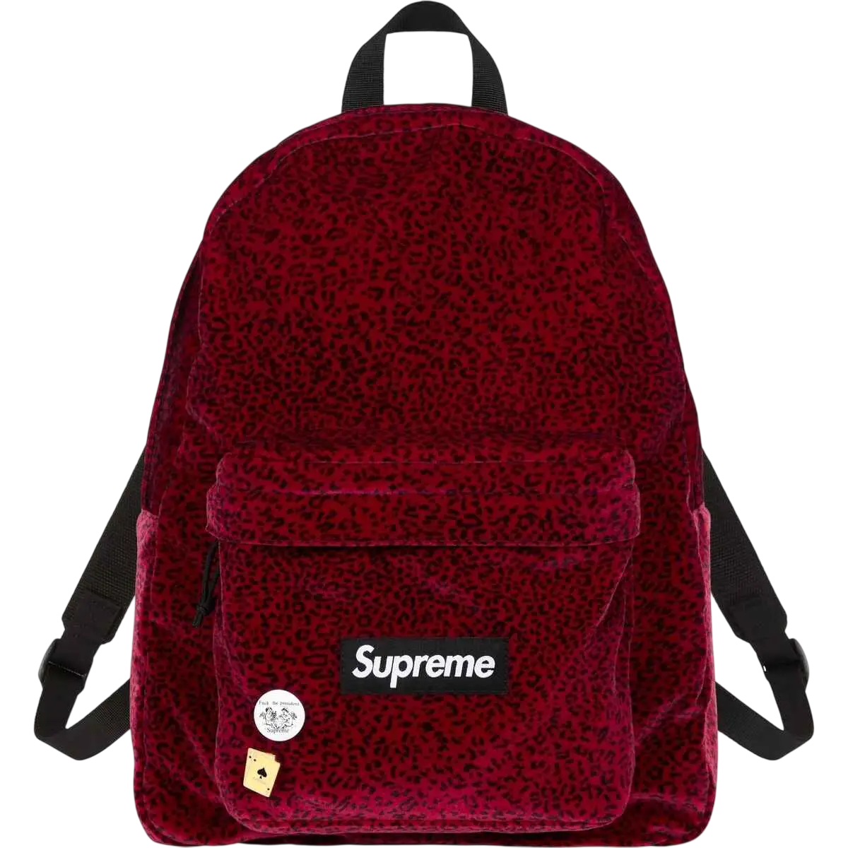A red velvet supreme backpack with subtle leopard print and decorative pins showcasing the brand logo patch