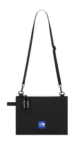 Black the north face shoulder bag with a blue logo patch and adjustable strap.