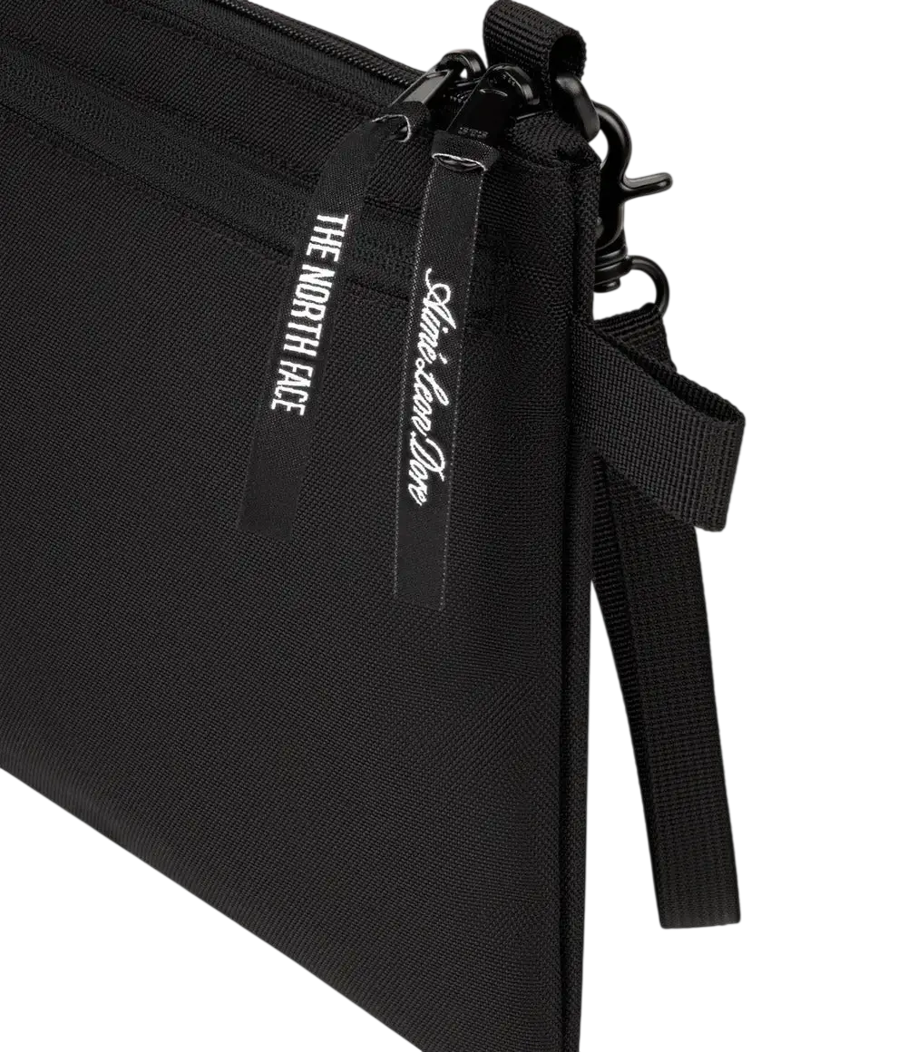 The north face x aime leon dore black nylon shoulder bag with zipper closure and branded tags