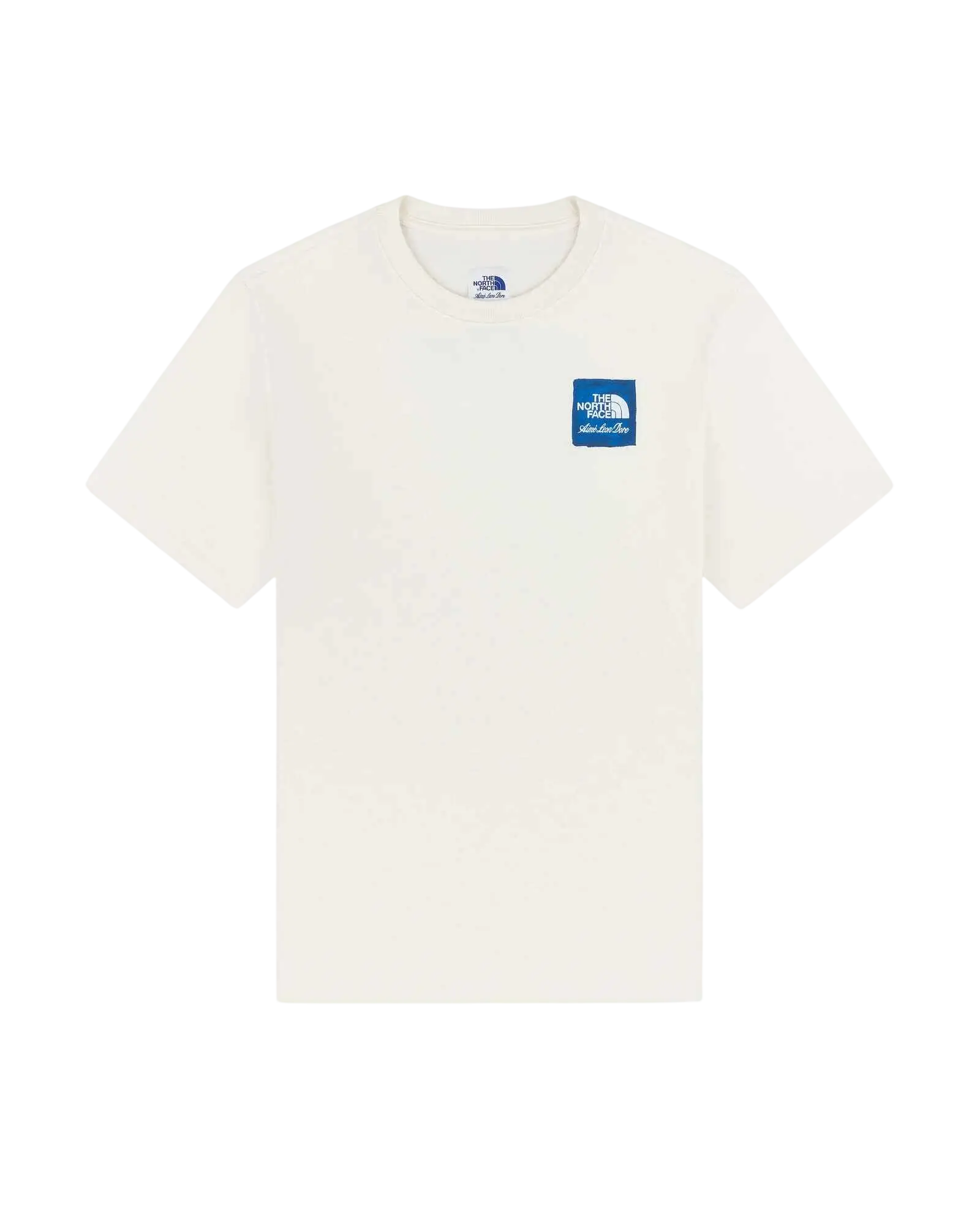 Cream-colored short-sleeved t-shirt with blue rectangular the north face logo patch on left chest from the north face x aime leon dore