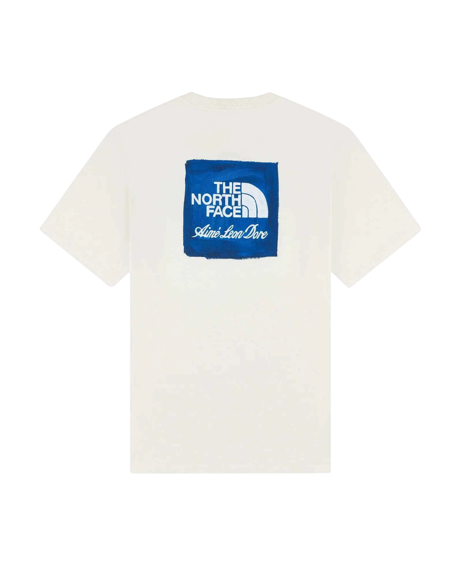 White cotton t-shirt featuring a blue square logo with the north face and aime leon dore text in ivory color